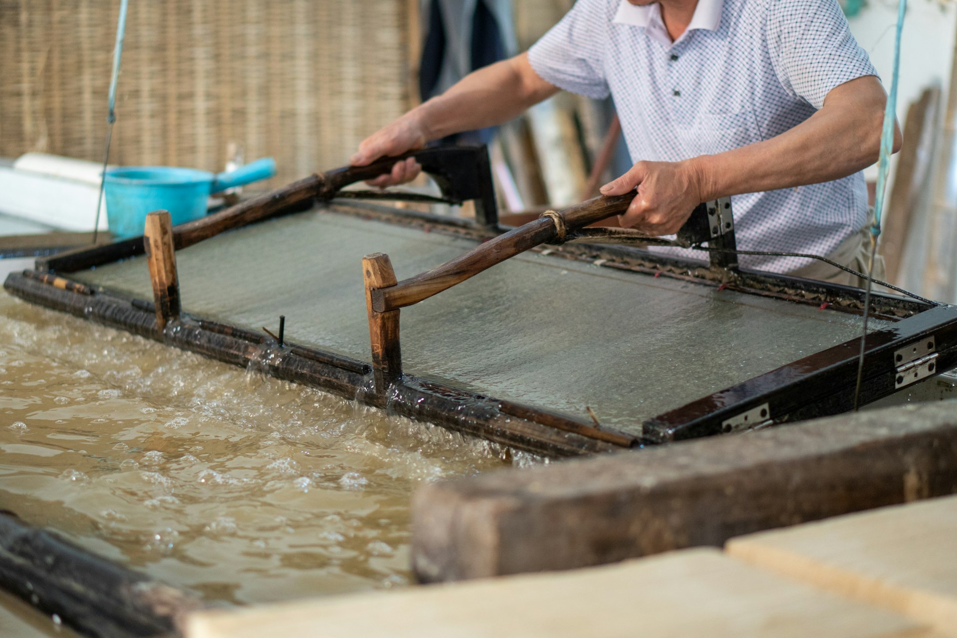 a man is making paper